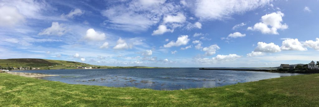Kirkwall panographic image of meadow and loch